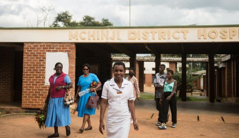 Nurses in Malawi leaving a hospital and smiling