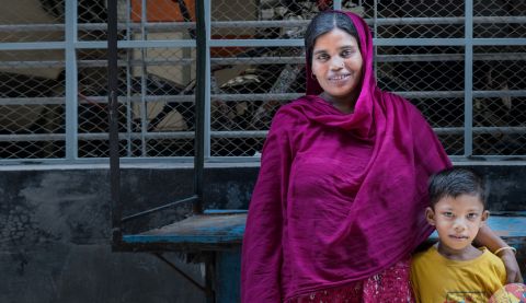 mother with her child in front of a bike