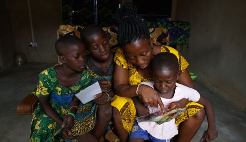 A family looking at old photos