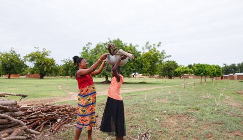 Woman helping a girl