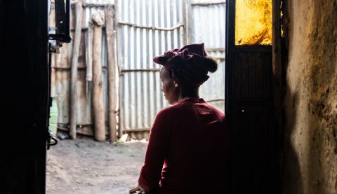Woman looking out and away