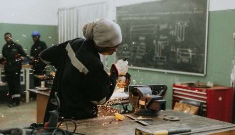 Woman doing metalwork 