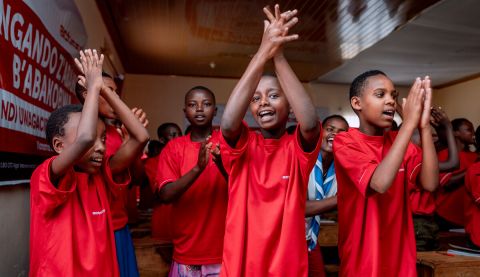 Girls clapping in a classroom