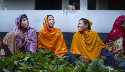 Women selling vegetables at a farmer's market