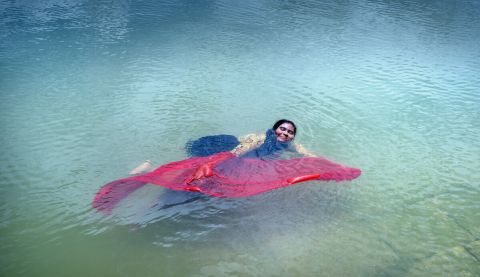 Woman floating in a lake