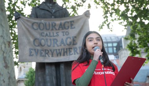 Community Campaigner, Ria, speaking at the People's Banquet