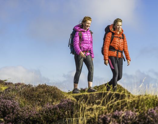 Two women climbing