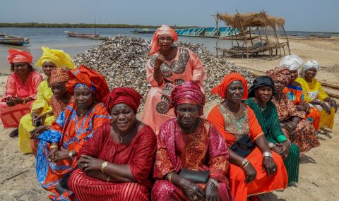 Aida Sarr (middle) with the women of Maya Island, whose daily lives are dedicated to fighting the rising sea levels on Maya. 
