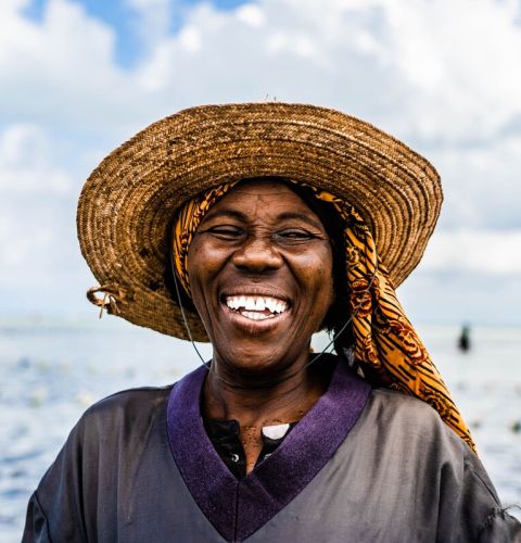 Fisherwoman looking at camera and laughing