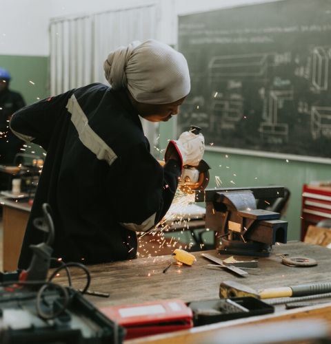 Woman doing metalwork 
