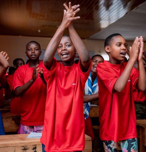Girls clapping in a classroom