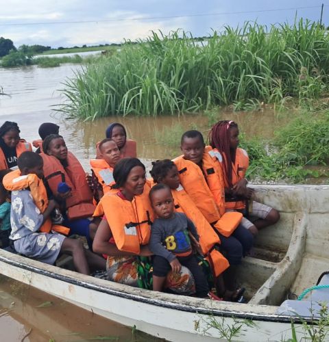 people being rescued on a boat