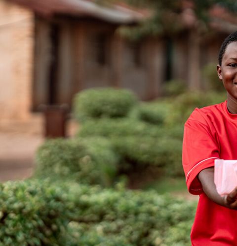 Girl holding up period pads