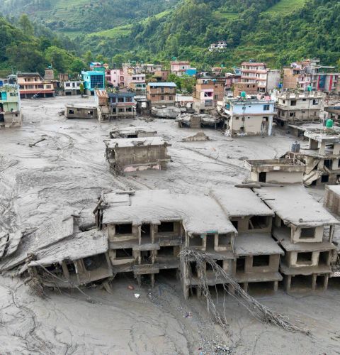 Aerial view showing residential buildings affected by the flash floods and landslide in Devighat, Bidur Municipality in Nepal's Nuwakot district.