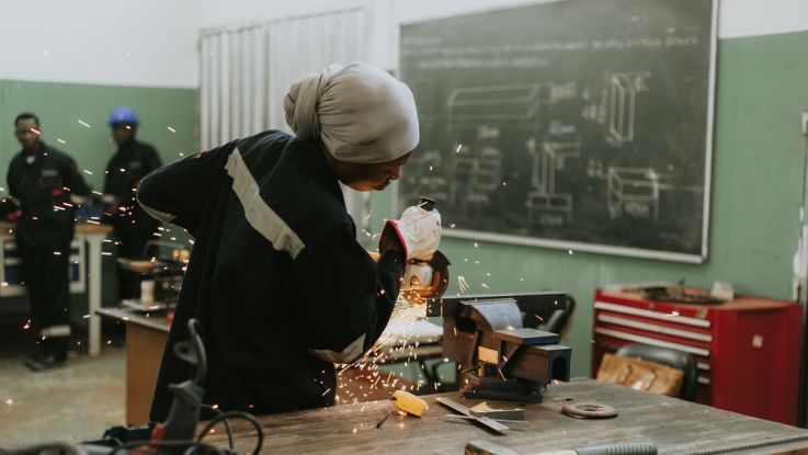 Woman doing metalwork 