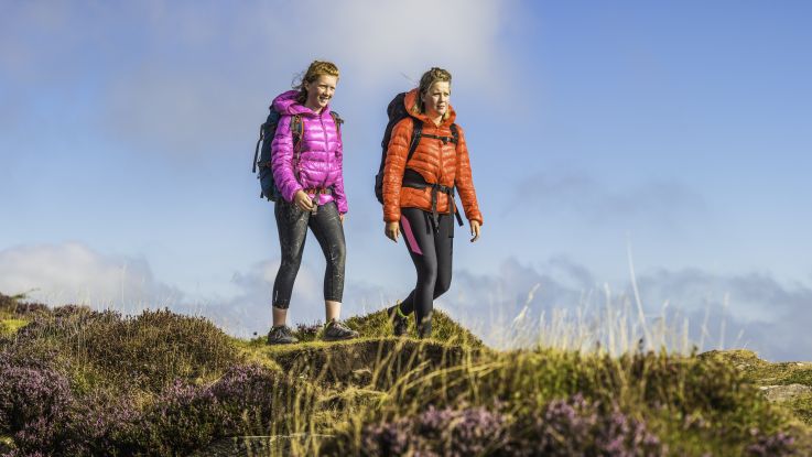 Two women climbing