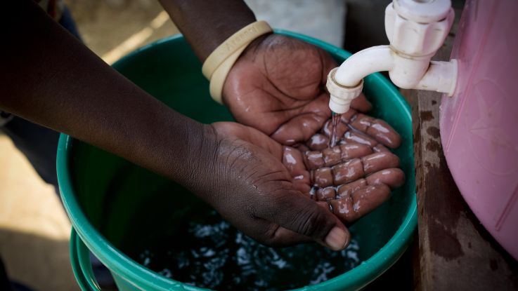 close up of hands being washed under tap